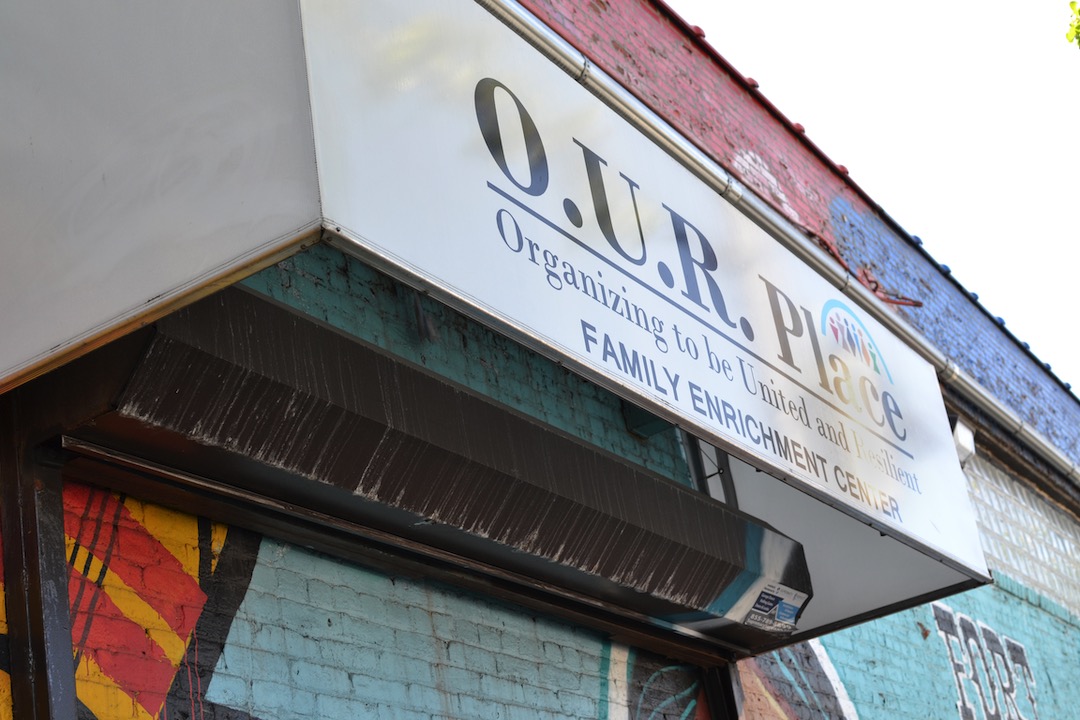 Photo of the exterior overhang sign for O.U.R Place Family Enrichment Center